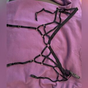 Victoria’s Secret black harness garter.sz M/L.  Comes with a pair of handcuffs.